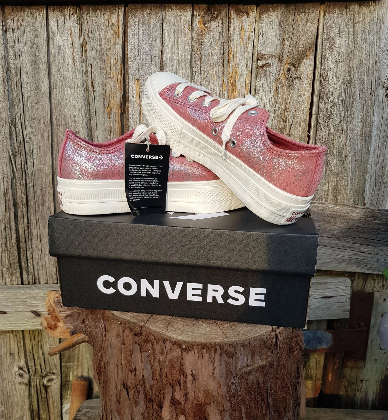 Converse plataforma rosa brillante cuero vuelto